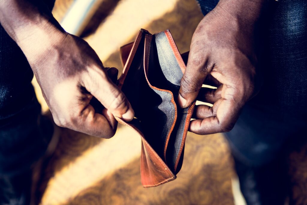Man checking his empty wallet