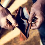 Man checking his empty wallet