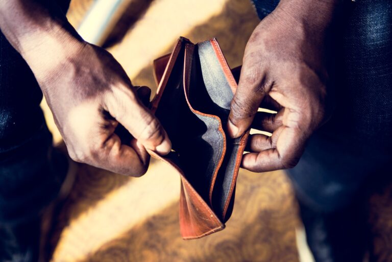 Man checking his empty wallet